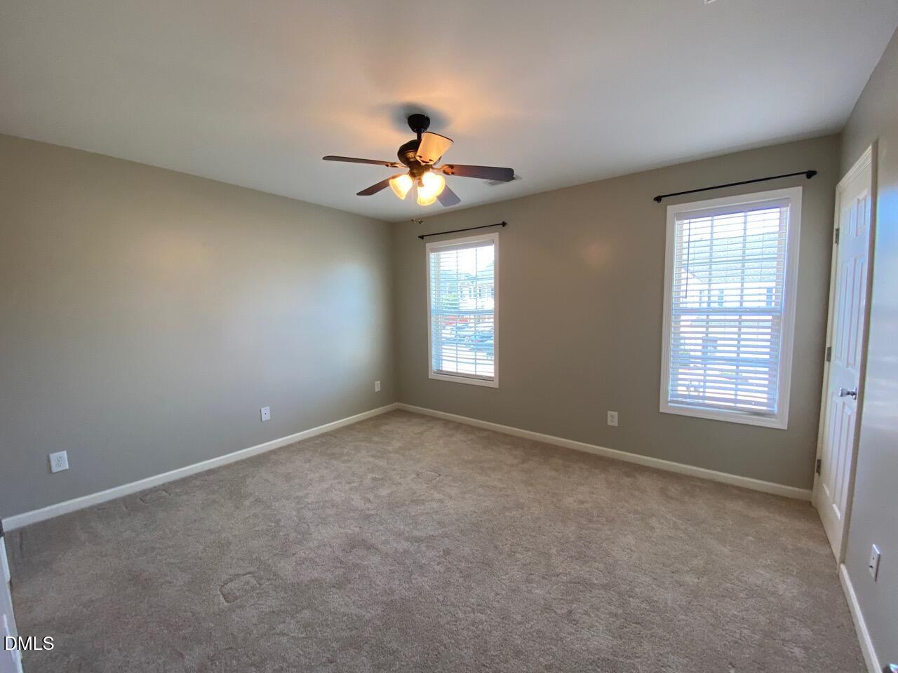 2513 Bay Harbor Drive Raleigh, NC 27604 - Photo 16 of 19 an empty room with windows and fan