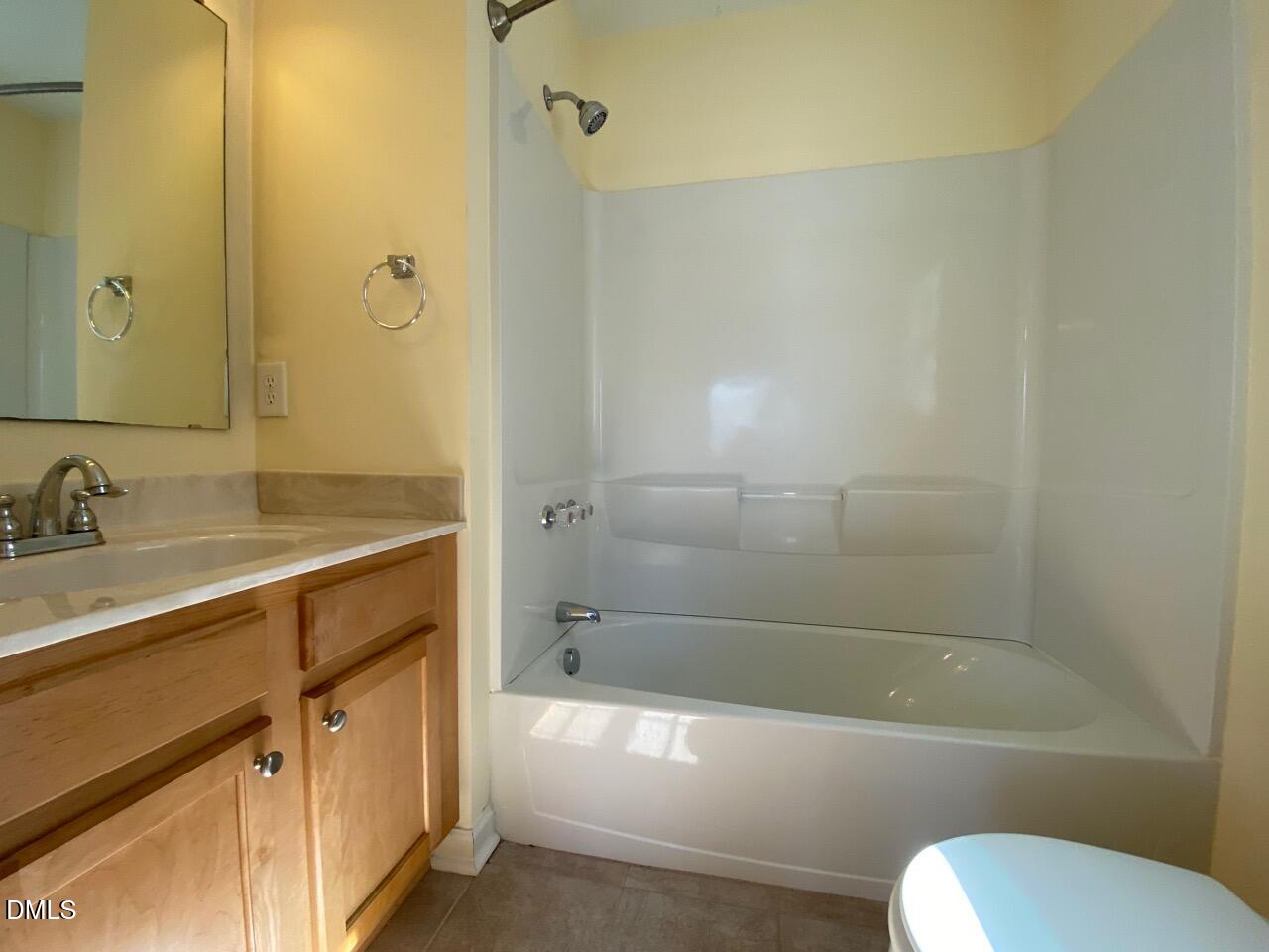 2513 Bay Harbor Drive Raleigh, NC 27604 - Photo 17 of 19 a bathroom with a sink toilet and bathtub