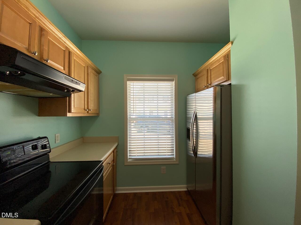2513 Bay Harbor Drive Raleigh, NC 27604 - Photo 6 of 19 a kitchen with a stove and a microwave