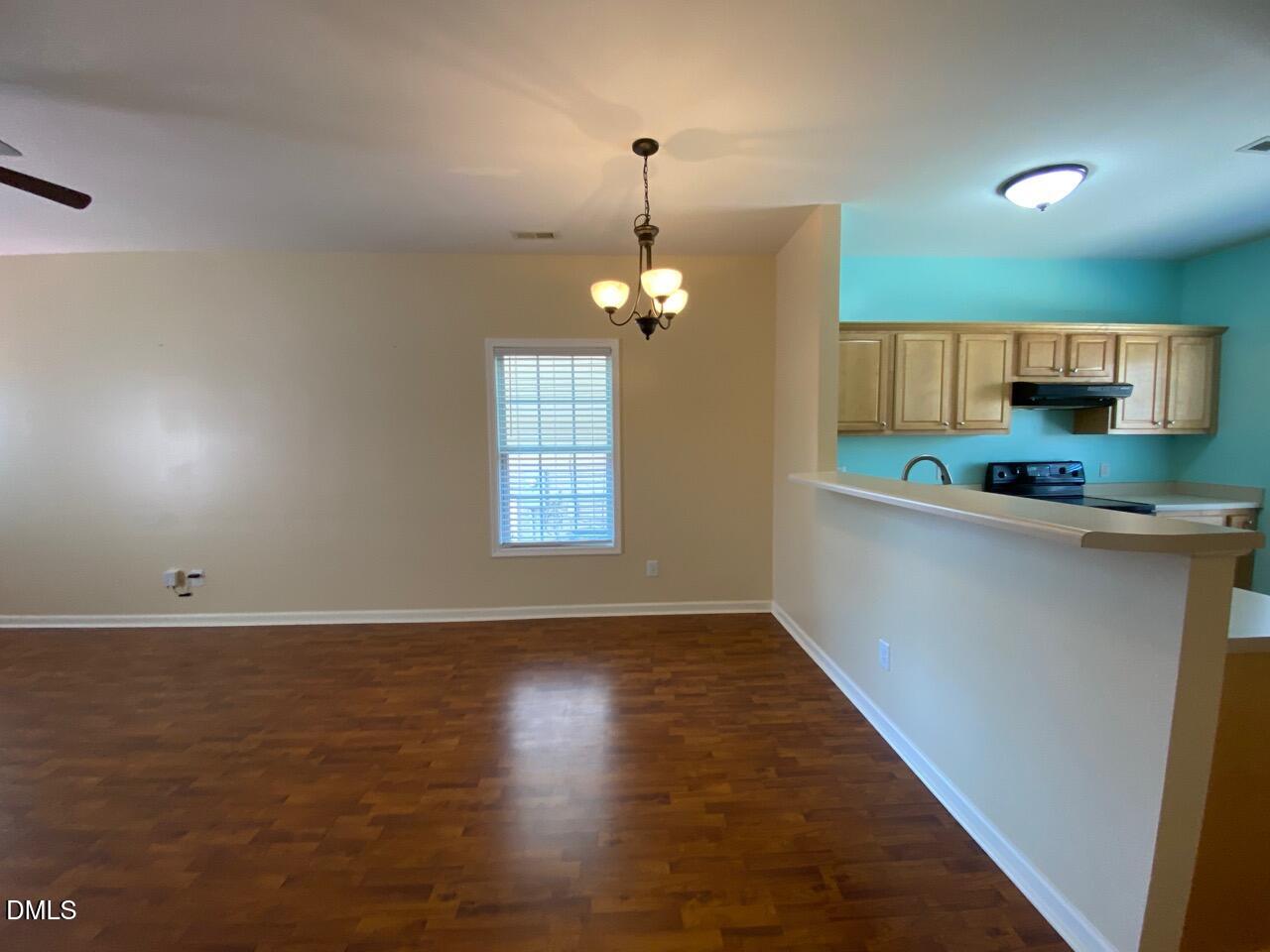 2513 Bay Harbor Drive Raleigh, NC 27604 - Photo 8 of 19 wooden floor in an empty room with a window
