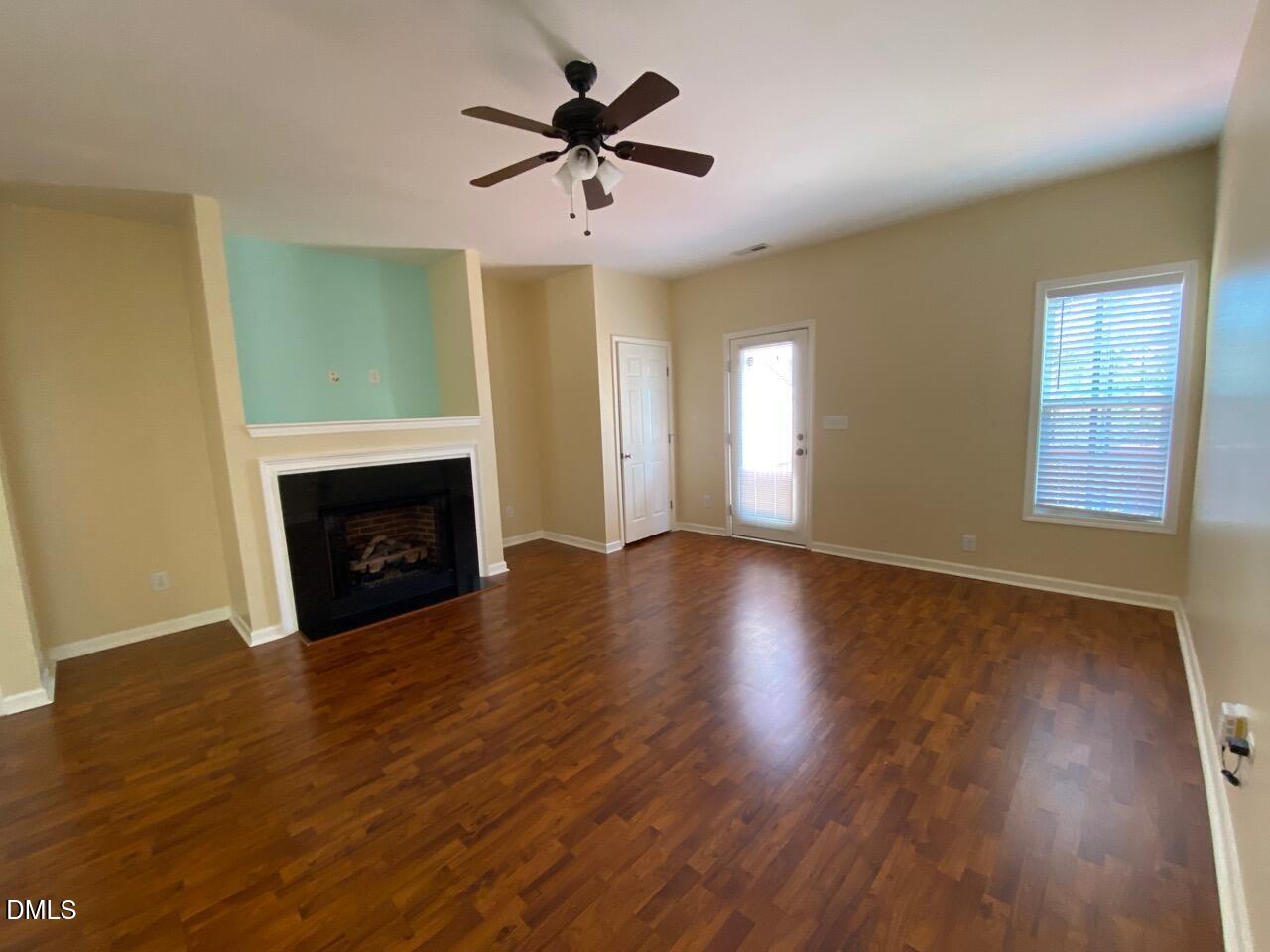 2513 Bay Harbor Drive Raleigh, NC 27604 - Photo 10 of 19 wooden floor in an empty room with a fireplace