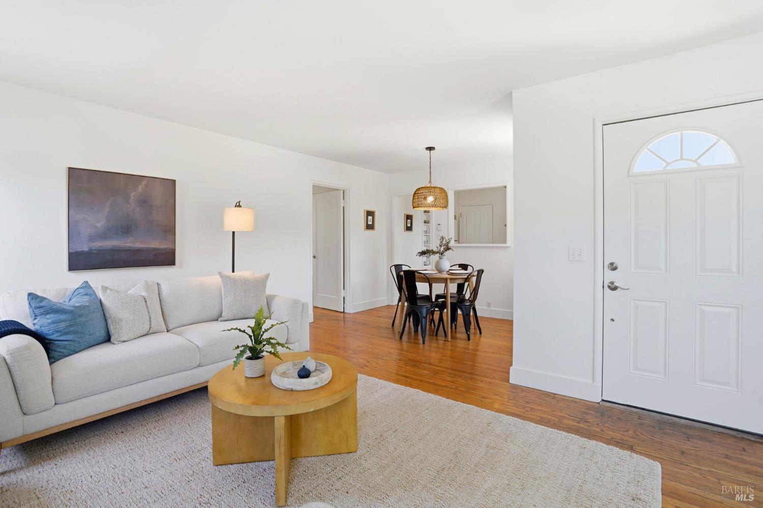 234 Solano Street San Rafael, CA 94901 - Photo 5 of 24 a living room with furniture and a chandelier