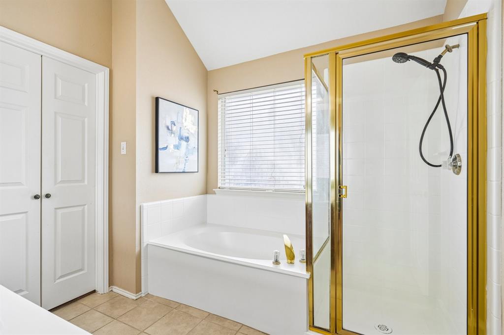 2705 Burning Tree McKinney, TX 75072 - Photo 20 of 35 a bathroom with a bathtub and a shower