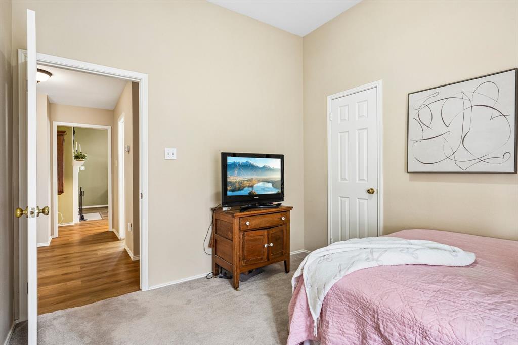 2705 Burning Tree McKinney, TX 75072 - Photo 24 of 35 a bedroom with a bed and a view of bathroom