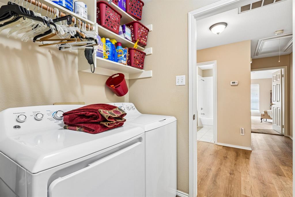 2705 Burning Tree McKinney, TX 75072 - Photo 28 of 35 a kitchen with a refrigerator and a stove