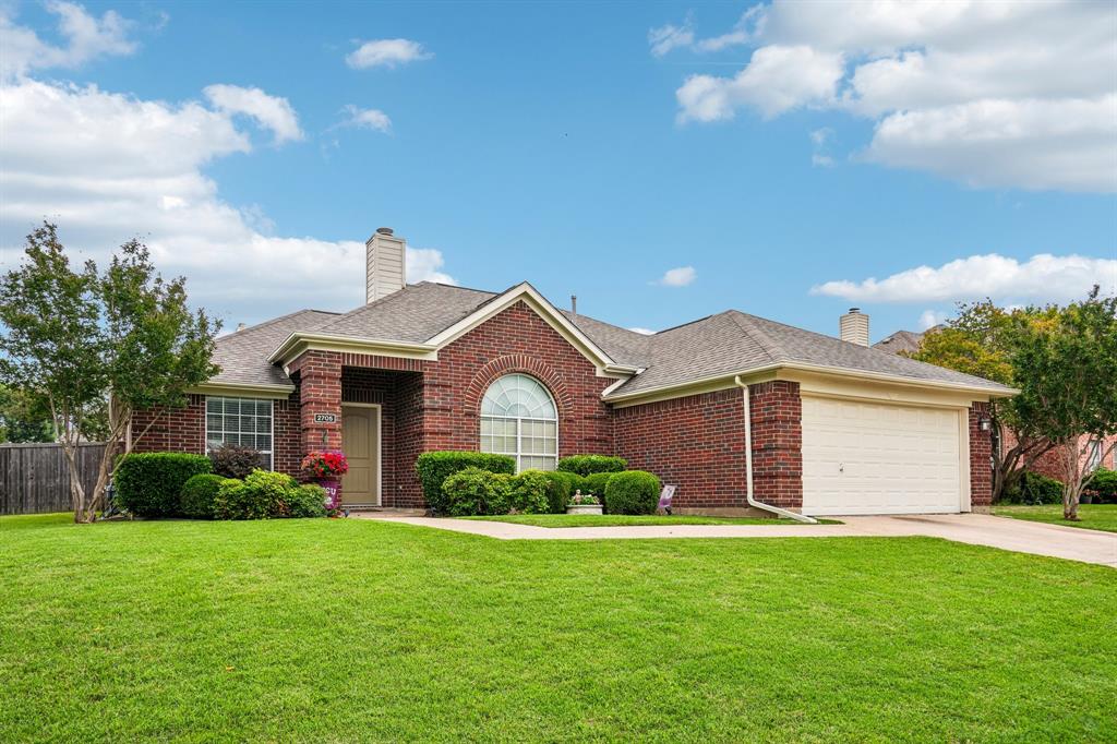 2705 Burning Tree McKinney, TX 75072 - Photo 4 of 35 a front view of a house with garden