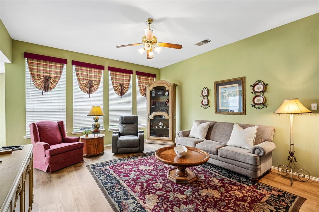 2705 Burning Tree McKinney, TX 75072 - Photo 5 of 35 a living room with furniture and a large window