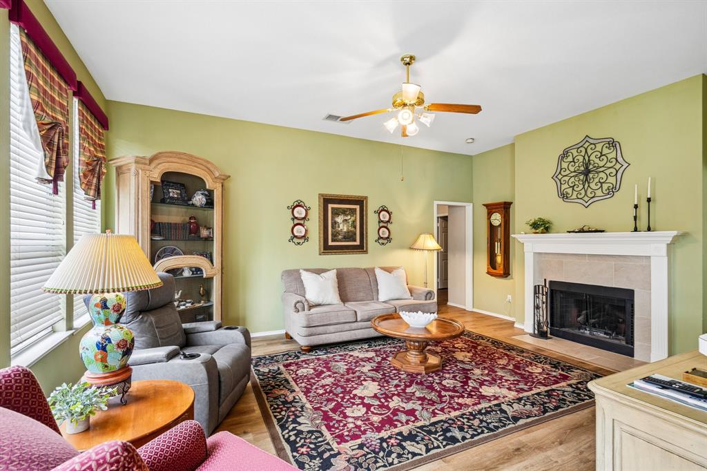 2705 Burning Tree McKinney, TX 75072 - Photo 6 of 35 a living room with furniture and a fireplace