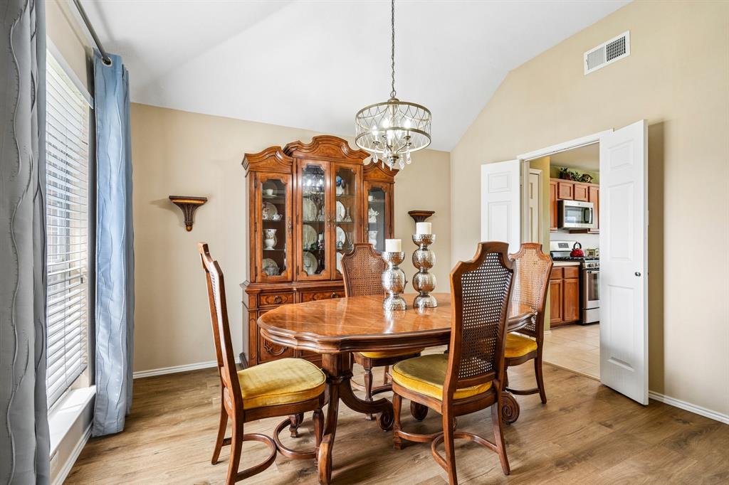 2705 Burning Tree McKinney, TX 75072 - Photo 9 of 35 a view of a dining room with furniture window and wooden floor