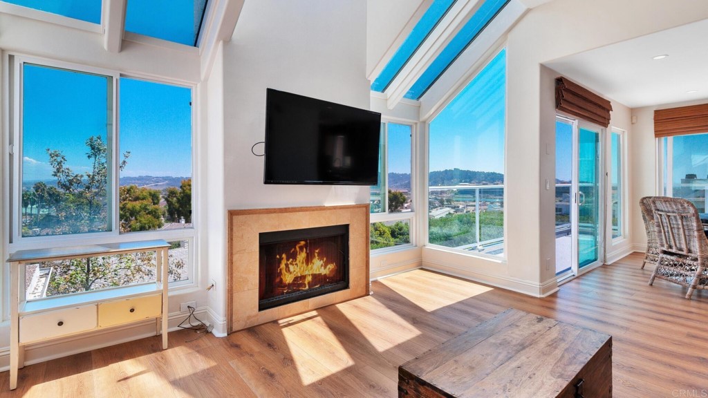 365 Longden Lane Solana Beach, CA 92075 - Photo 11 of 26 a living room with furniture a flat screen tv and a fireplace