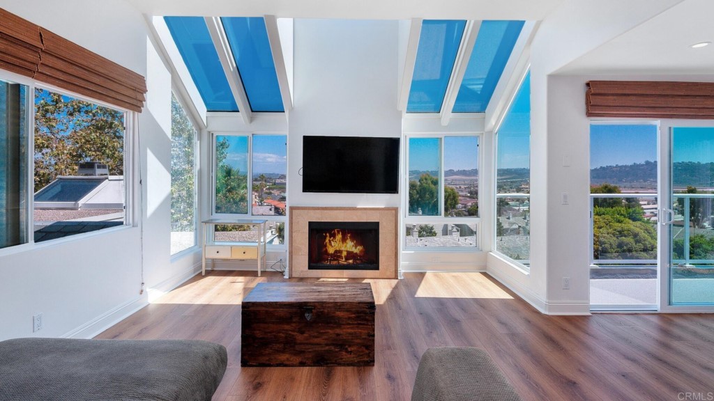 365 Longden Lane Solana Beach, CA 92075 - Photo 13 of 26 a living room with furniture a fireplace and a flat screen tv