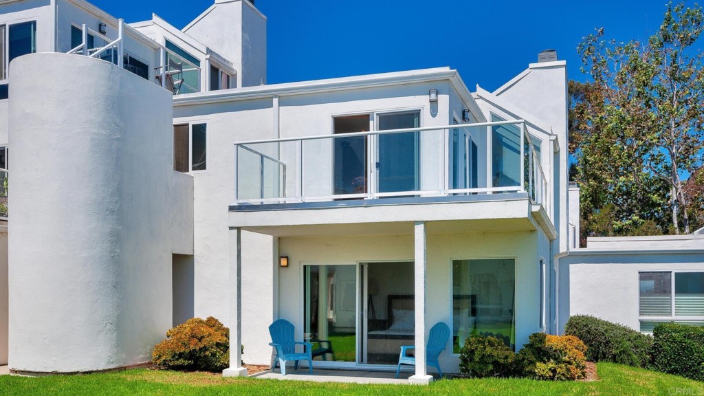 365 Longden Lane Solana Beach, CA 92075 - Photo 18 of 26 a view of a white house with potted plants and a yard