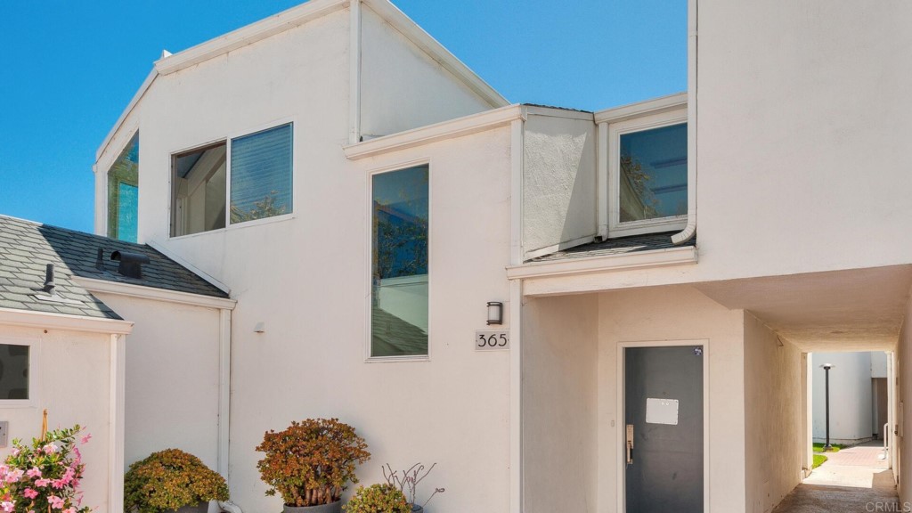 365 Longden Lane Solana Beach, CA 92075 - Photo 24 of 26 a front view of a house with lots of flowers