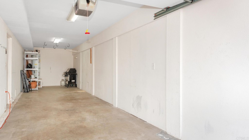 365 Longden Lane Solana Beach, CA 92075 - Photo 26 of 26 a view of a hallway with a refrigerator and window