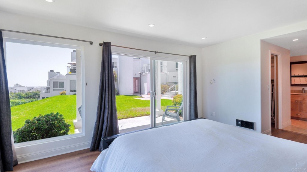 365 Longden Lane Solana Beach, CA 92075 - Photo 3 of 26 a bedroom with a bed and a view of balcony