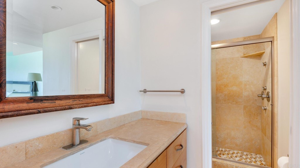 365 Longden Lane Solana Beach, CA 92075 - Photo 5 of 26 a bathroom with a sink and a mirror