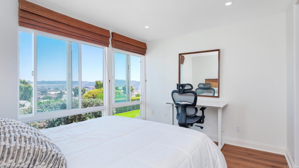 365 Longden Lane Solana Beach, CA 92075 - Photo 8 of 26 a bed sitting in a bedroom next to a window