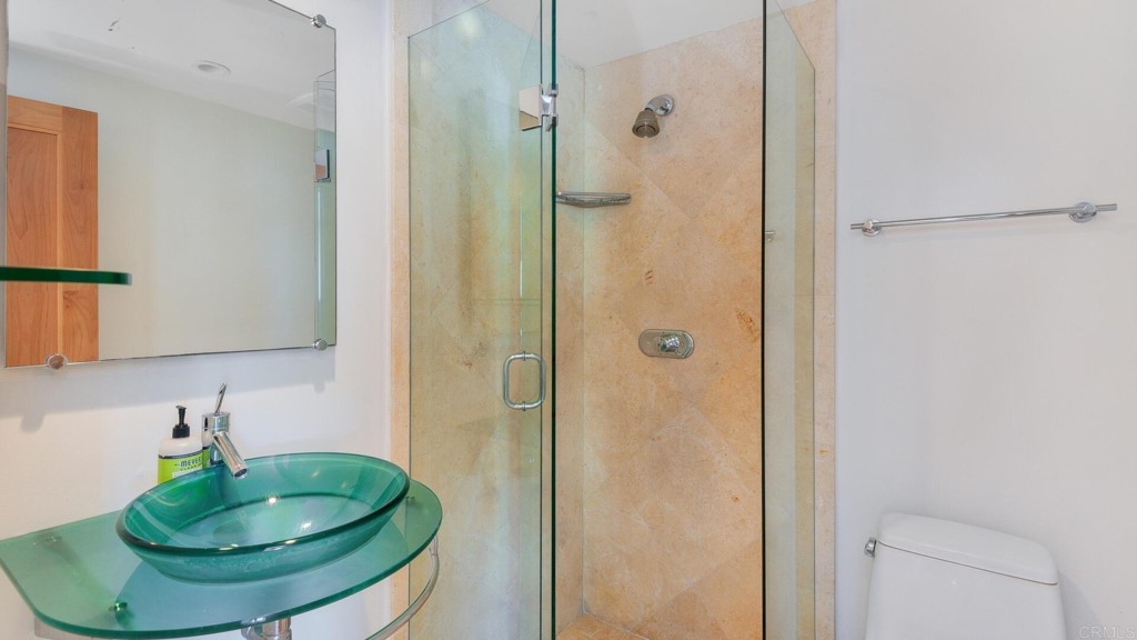 365 Longden Lane Solana Beach, CA 92075 - Photo 9 of 26 a bathroom with a sink and shower