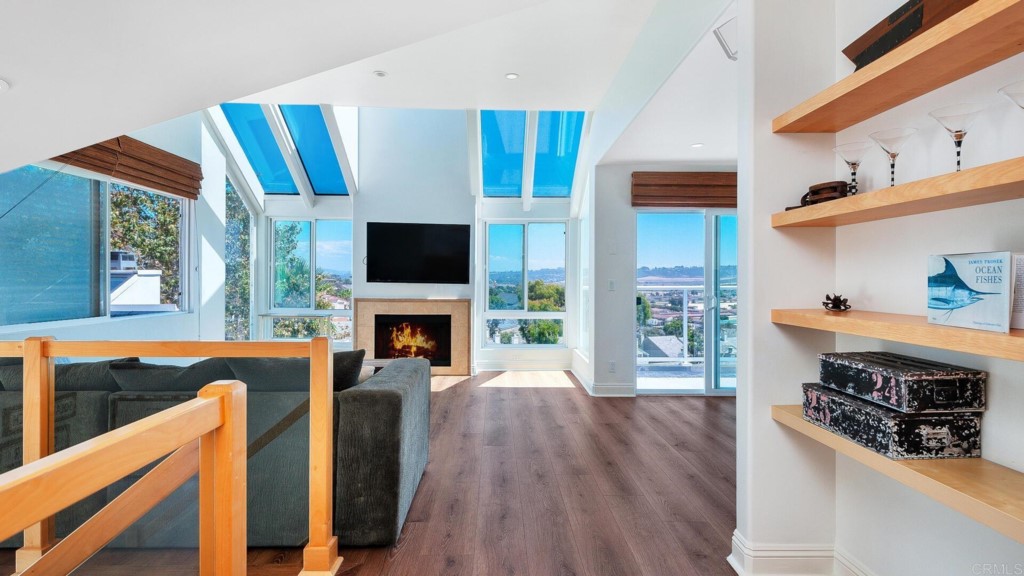 365 Longden Lane Solana Beach, CA 92075 - Photo 10 of 26 a living room with furniture a fireplace and a flat screen tv