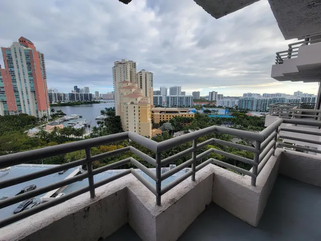 a view of a roof deck with couches and city view