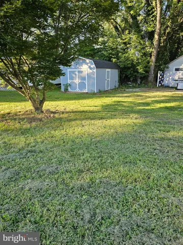 a view of a swimming pool with an outdoor space and seating area