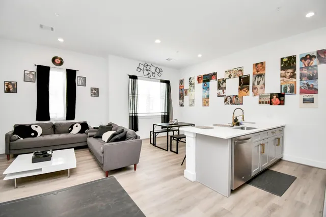 a living room with furniture and large window