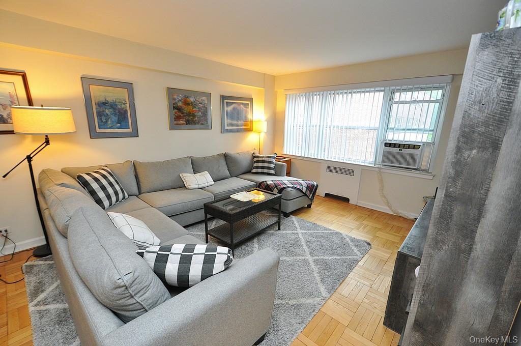 235 Garth Road, Unit A5B Scarsdale, NY 10583 - Photo 2 of 47 a living room with furniture and a window