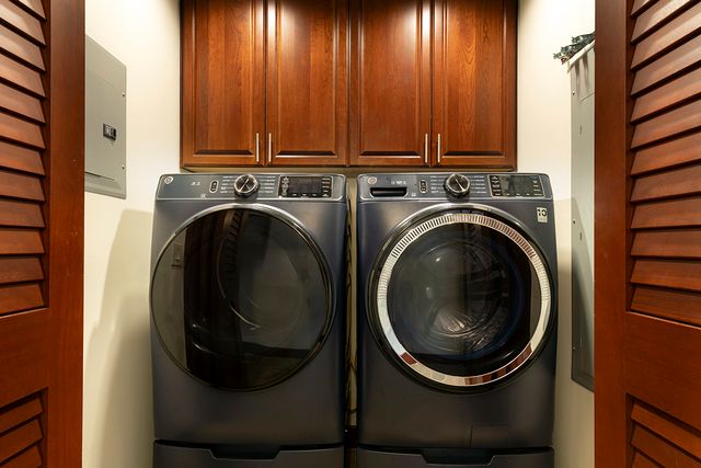 a view of a hallway with washer and dryer