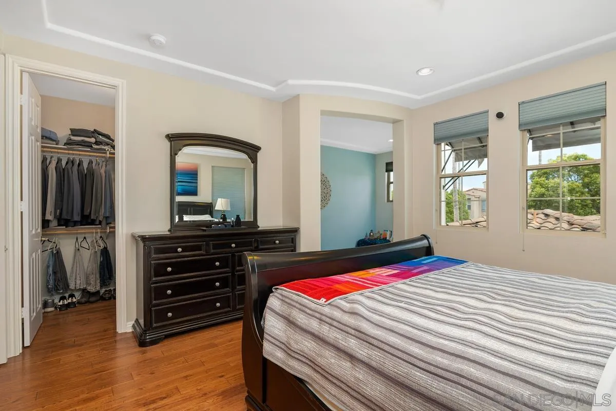 2124 Historic Decatur Road San Diego, CA 92106 - Photo 13 of 40 a bedroom with a bed and a mirror