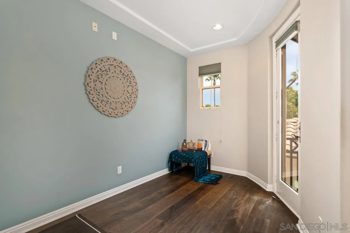 2124 Historic Decatur Road San Diego, CA 92106 - Photo 16 of 40 a view of a room with wooden floor and a window