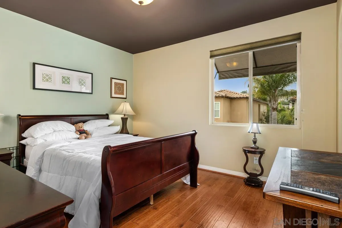 2124 Historic Decatur Road San Diego, CA 92106 - Photo 20 of 40 a bedroom with a bed and a window