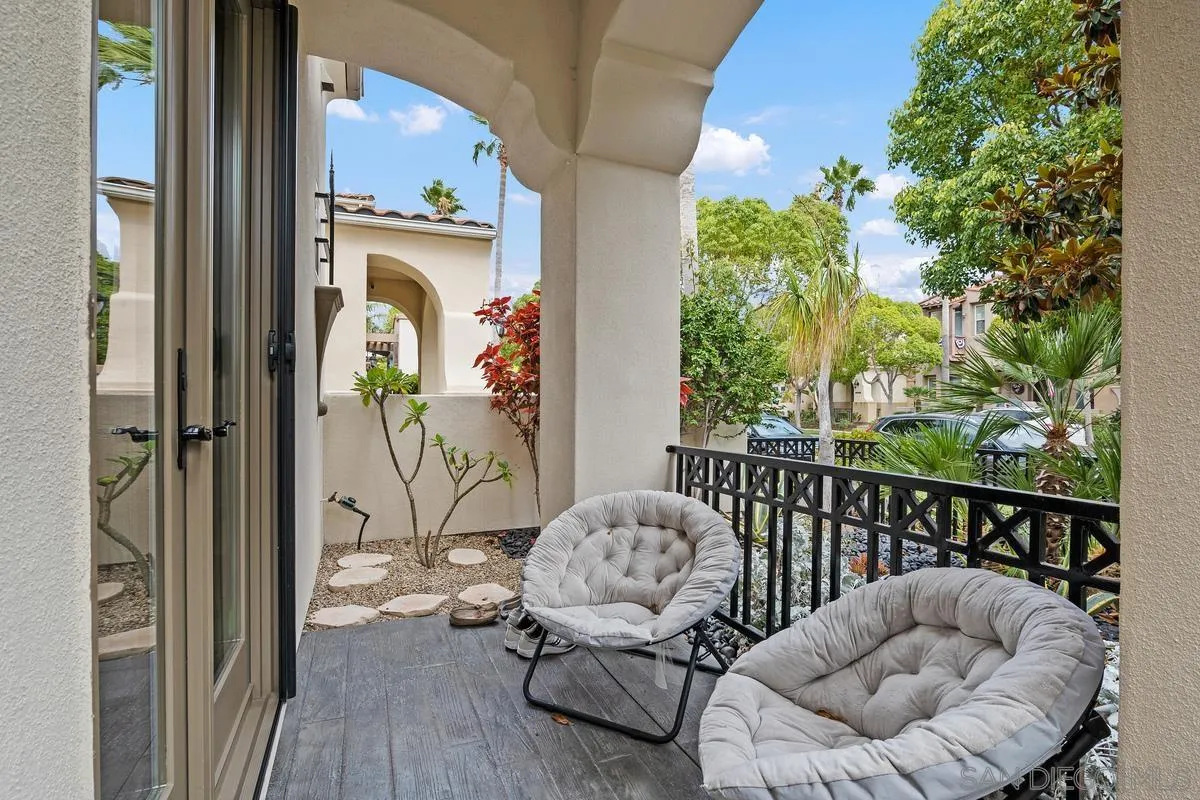 2124 Historic Decatur Road San Diego, CA 92106 - Photo 29 of 40 a view of balcony with furniture and wooden floor