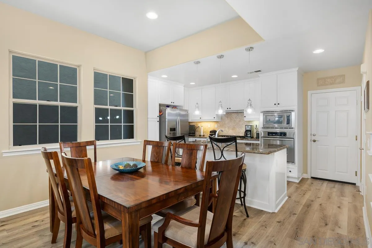 2124 Historic Decatur Road San Diego, CA 92106 - Photo 7 of 40 a view of a dining room with furniture and wooden floor