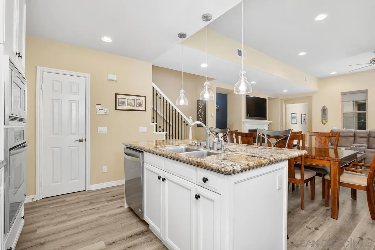 2124 Historic Decatur Road San Diego, CA 92106 - Photo 9 of 40 a kitchen with center island table and chairs