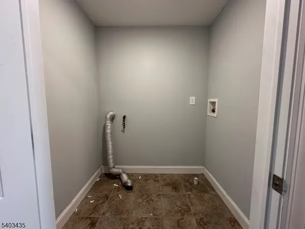 a view of a room with rack on the wall
