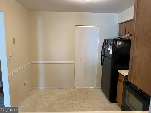 an empty room with wooden floor