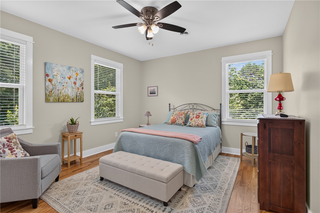 405 Pawnee Drive Walhalla, SC 29691 - Photo 15 of 36 Hardwood floors and bright windows create an inviting, airy bedroom retreat.