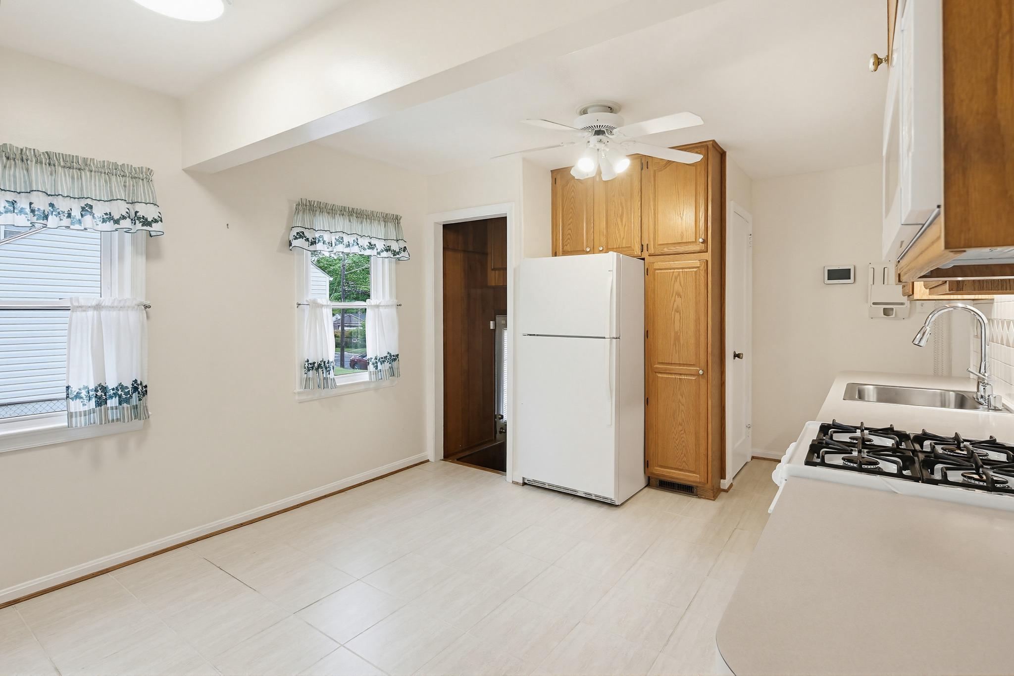 12007 St Dunston Lane Silver Spring, MD 20906 - Photo 10 of 40 Kitchen to side driveway entrance and lower level