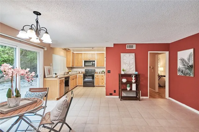 a bathroom with a granite countertop sink and a toilet