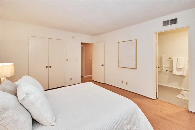 a bathroom with a sink mirror and a shower
