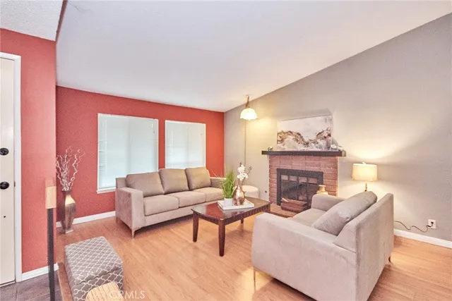 a living room with furniture and a fireplace