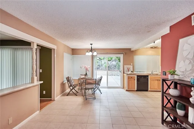 a dining room with furniture and chandelier