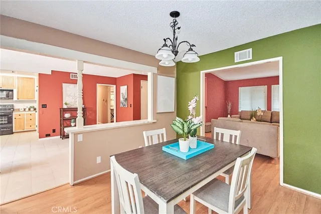 a kitchen with stainless steel appliances granite countertop a stove a sink dishwasher and a refrigerator