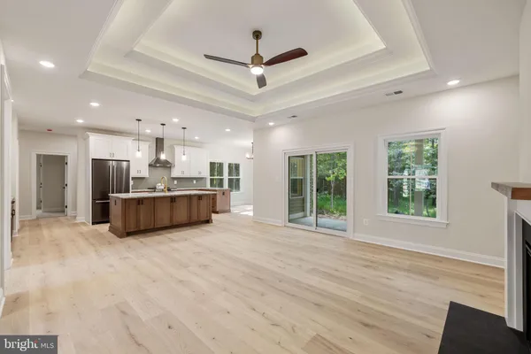 a view of an empty room and fire place