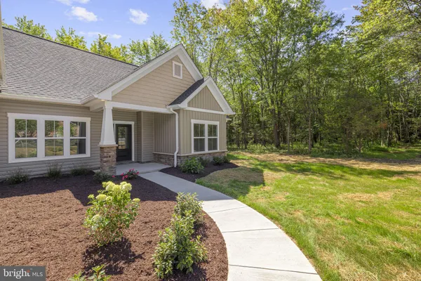 a front view of a house with a garage