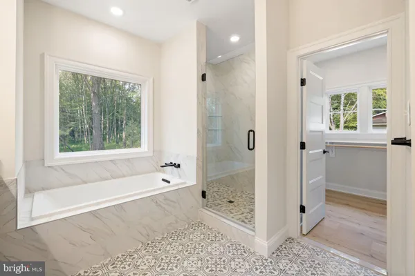 a bathroom with a sink a toilet and a bathtub