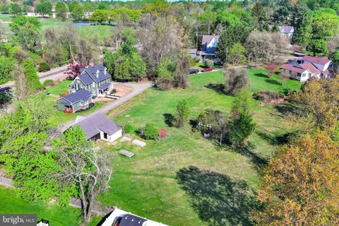 a aerial view of a house with a yard and garden