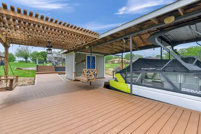 a view of a porch with wooden floor