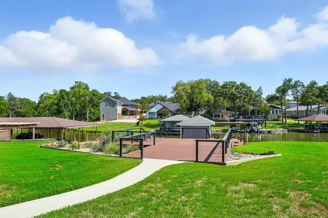 a view of a house with a big yard and a slide
