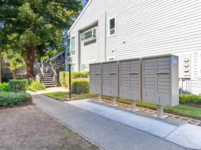 a view of a house with a yard and garage